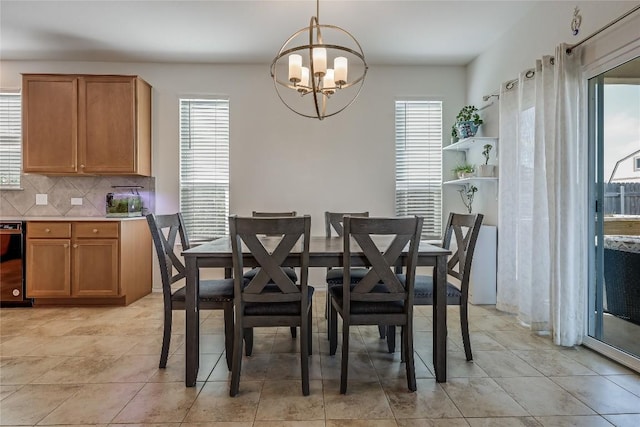 dining area featuring an inviting chandelier