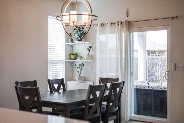 dining area with an inviting chandelier