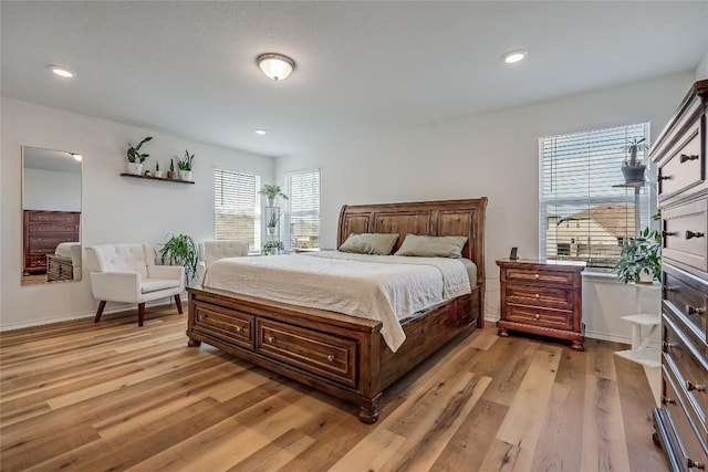 bedroom with light hardwood / wood-style floors