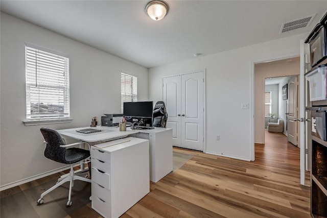 office space featuring light hardwood / wood-style flooring