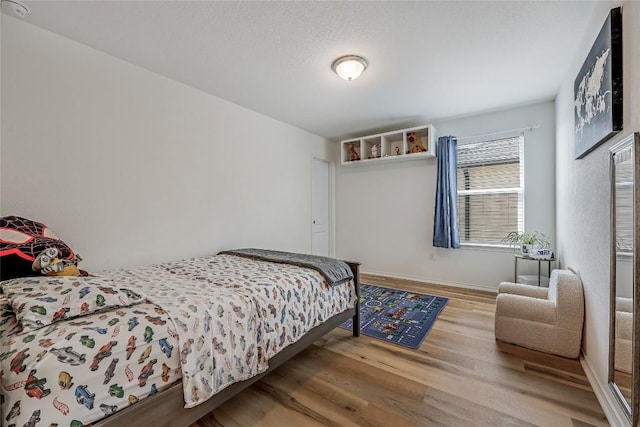 bedroom featuring light hardwood / wood-style flooring