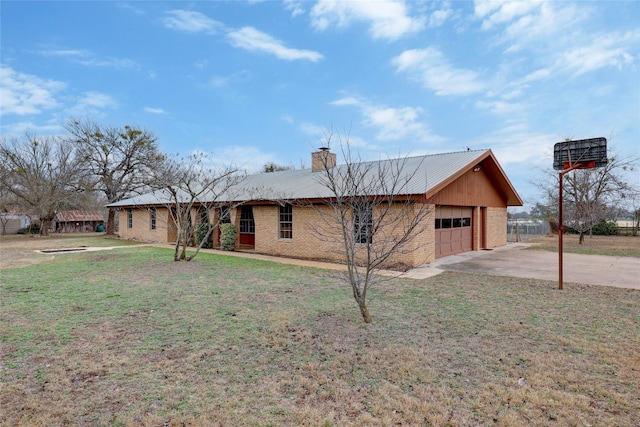 ranch-style home featuring a garage and a front yard