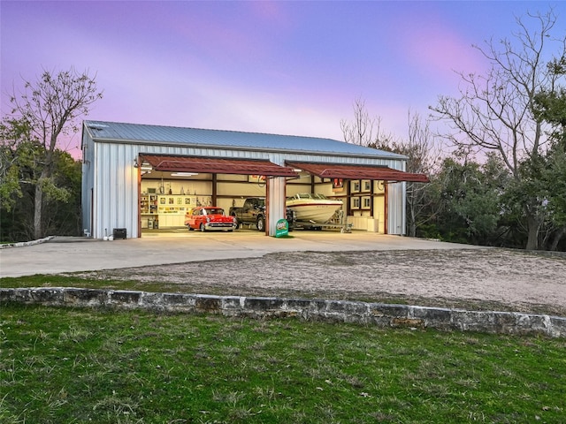 outdoor structure at dusk with a garage