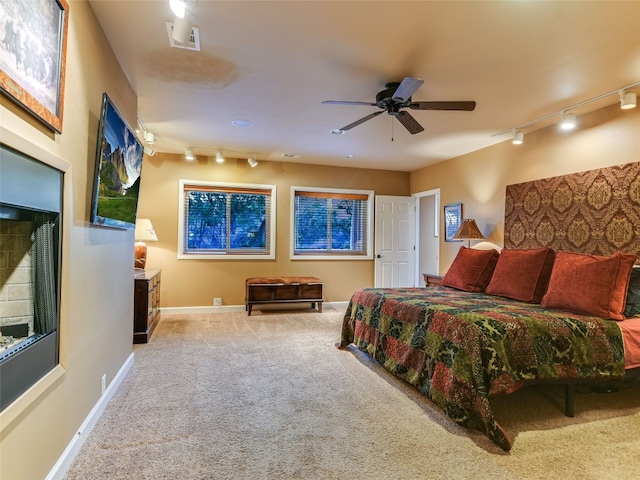 carpeted bedroom featuring baseboards