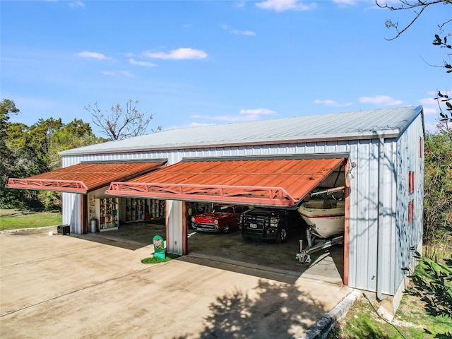 view of parking / parking lot with a pole building and a carport