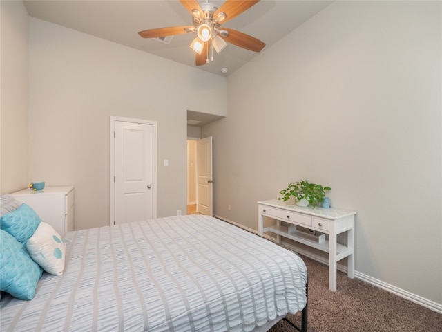 bedroom featuring lofted ceiling, ceiling fan, and carpet floors