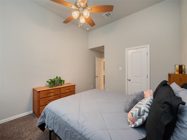 carpeted bedroom with vaulted ceiling and ceiling fan