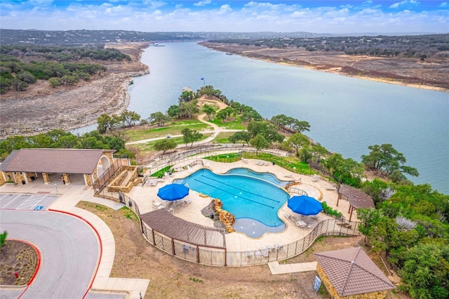 bird's eye view with a water view and a community pool