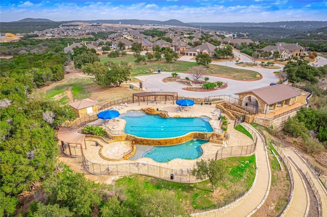 view of swimming pool with a mountain view