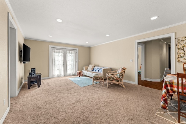 living room with ornamental molding, carpet flooring, a textured ceiling, and french doors