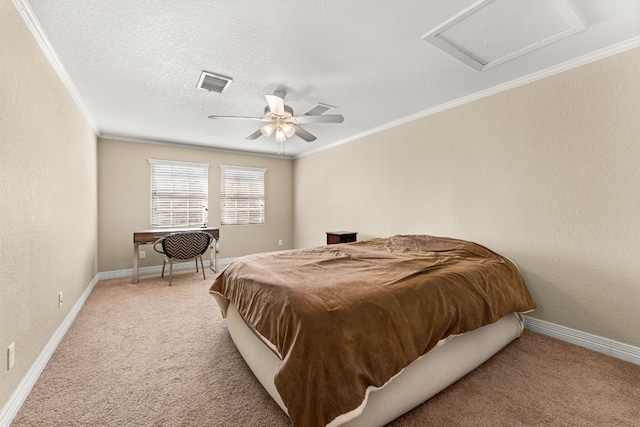 bedroom with ceiling fan, light colored carpet, ornamental molding, and a textured ceiling