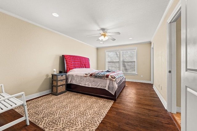 bedroom featuring ceiling fan, ornamental molding, hardwood / wood-style floors, and a textured ceiling