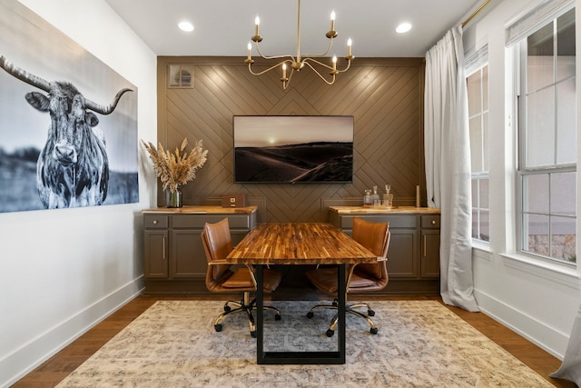 interior space featuring a notable chandelier and dark hardwood / wood-style flooring