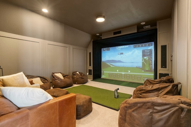 carpeted home theater room featuring golf simulator