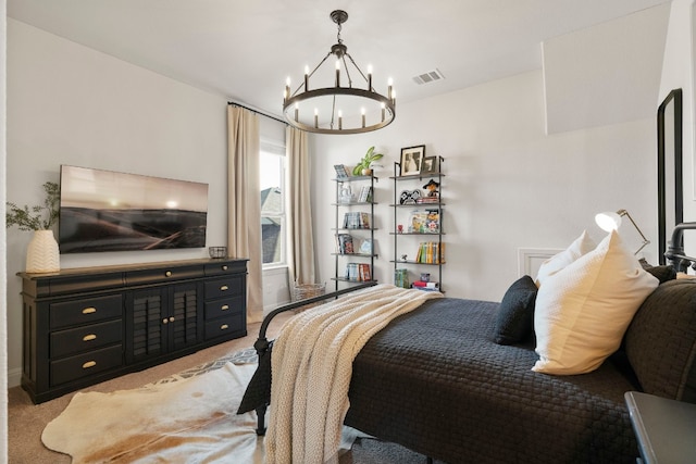 bedroom with an inviting chandelier and light colored carpet