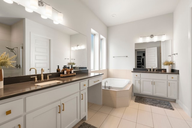 bathroom featuring tile patterned floors, vanity, and separate shower and tub