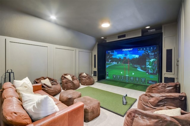 carpeted cinema with golf simulator, recessed lighting, and a decorative wall