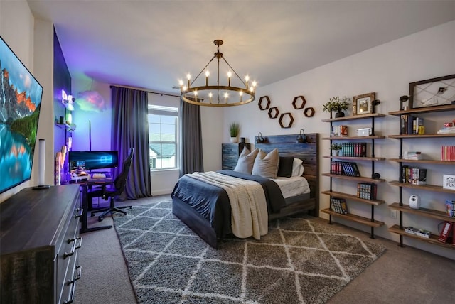 bedroom with a chandelier and dark carpet