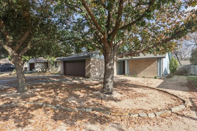 ranch-style home with a garage