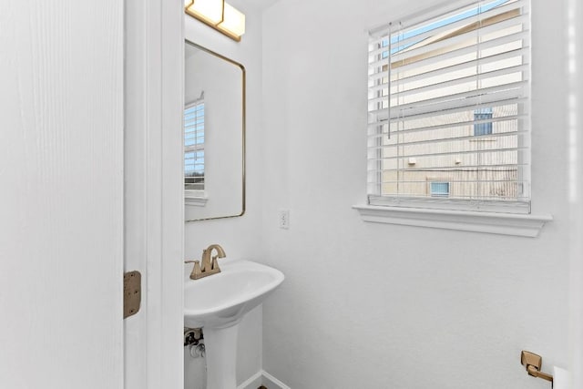 bathroom featuring plenty of natural light and sink