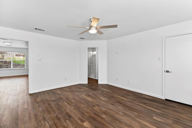 spare room featuring dark hardwood / wood-style floors and ceiling fan