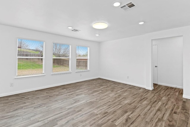 unfurnished room featuring light hardwood / wood-style flooring