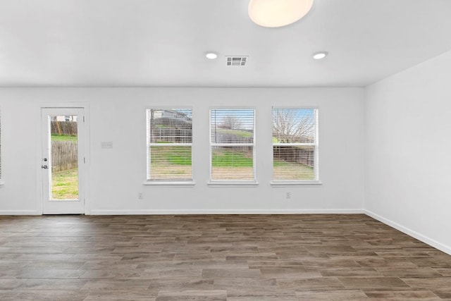 empty room with dark hardwood / wood-style floors