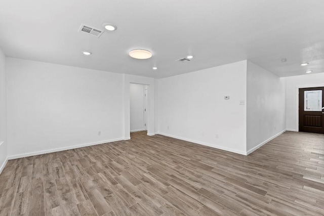 unfurnished room with light hardwood / wood-style flooring