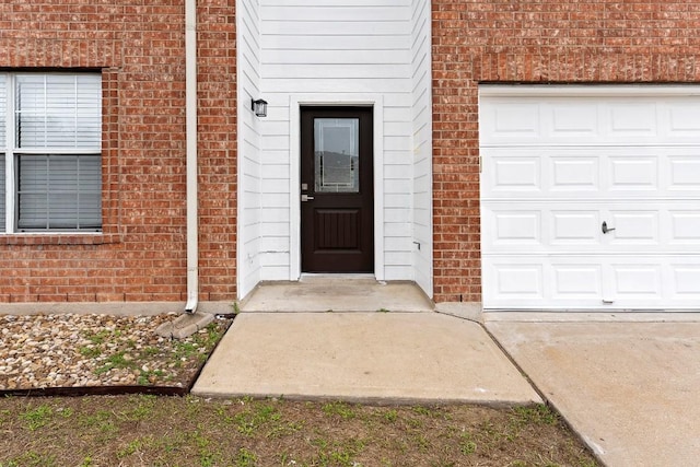 doorway to property featuring a garage