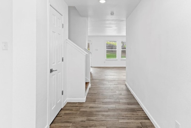 corridor with dark hardwood / wood-style floors