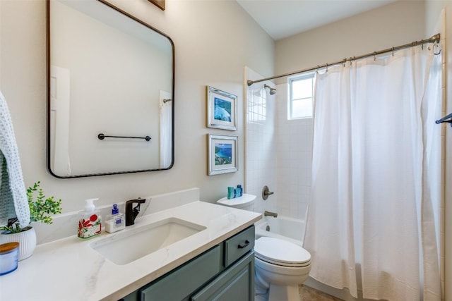 full bathroom with vanity, shower / bath combo with shower curtain, and toilet