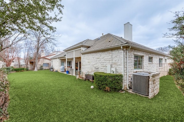 exterior space with a yard and cooling unit