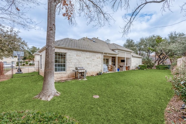 rear view of house with a lawn