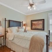 501 S College St Unit 501, Georgetown, TX 78626 - bedroom with ornamental molding and ceiling fan