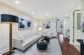 living room with wood finished floors and recessed lighting