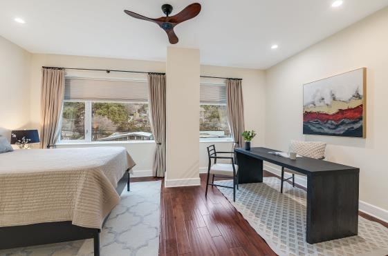 bedroom featuring multiple windows, recessed lighting, dark wood finished floors, and baseboards