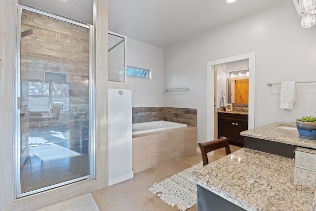 bathroom featuring vanity, tile patterned floors, and separate shower and tub