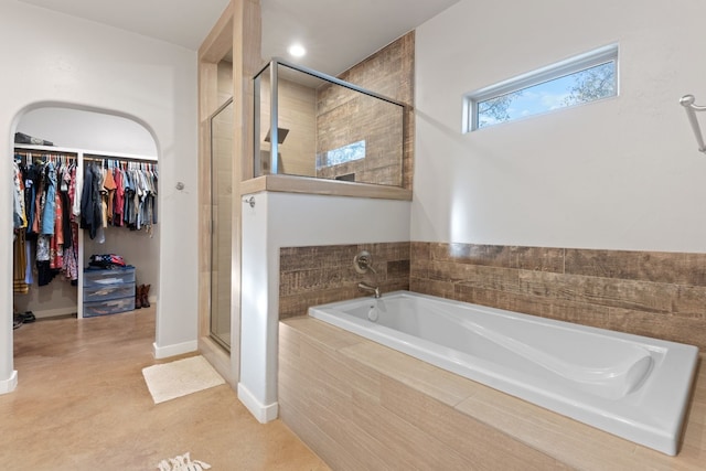 bathroom featuring plus walk in shower