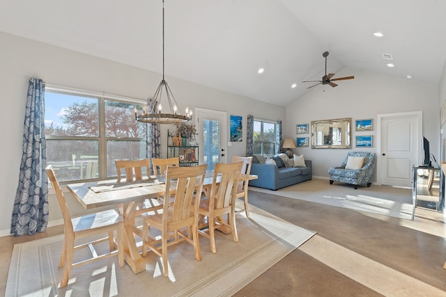 dining room with ceiling fan with notable chandelier and high vaulted ceiling