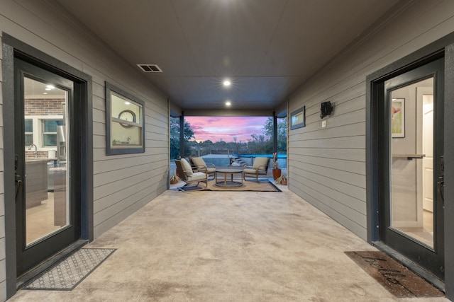 patio terrace at dusk with outdoor lounge area