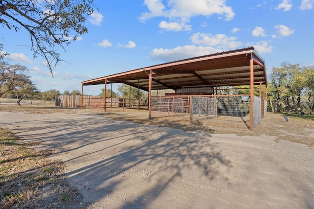 exterior space featuring an outdoor structure and a rural view