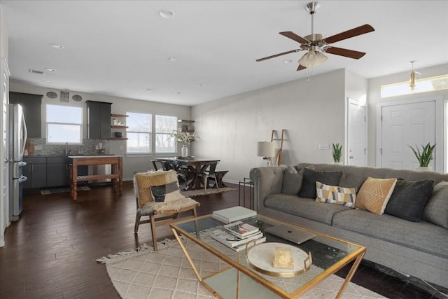 living room with sink and dark hardwood / wood-style flooring