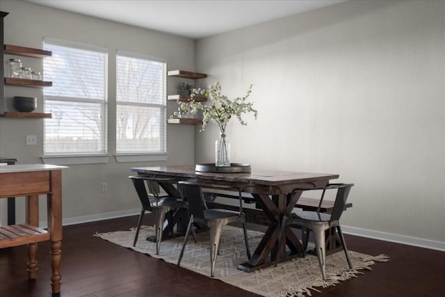 dining space featuring dark hardwood / wood-style floors