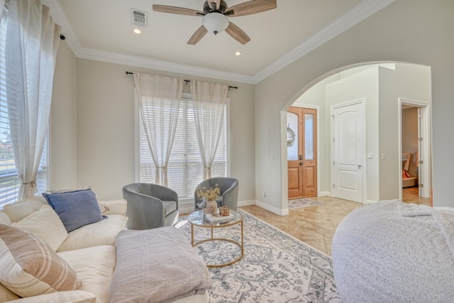 living room featuring ornamental molding, ceiling fan, and light tile patterned flooring