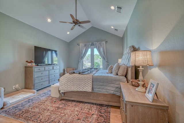 bedroom featuring vaulted ceiling, ceiling fan, and light wood-type flooring