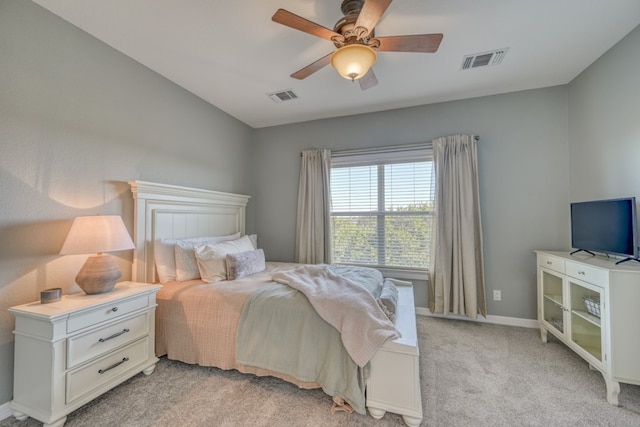 bedroom with ceiling fan and light colored carpet