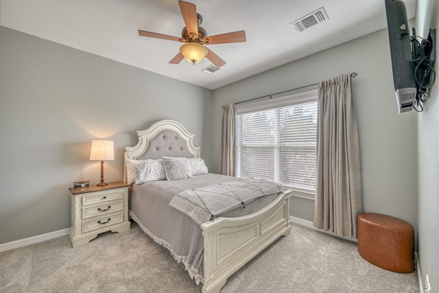 bedroom featuring light carpet and ceiling fan