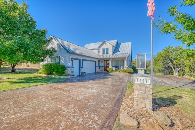 view of front of home featuring a garage and a front yard