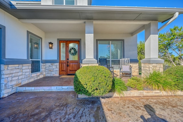 doorway to property featuring a porch