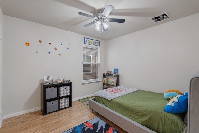 bedroom featuring ceiling fan and light hardwood / wood-style flooring